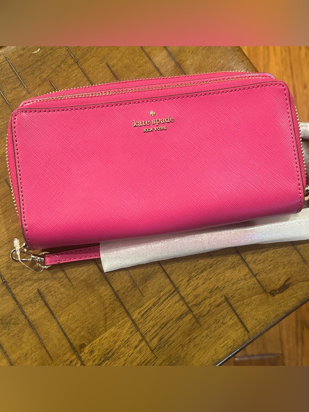 kate spade vibrant pink zip-around wallet with gold logo